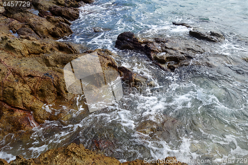 Image of Waves on stone beach