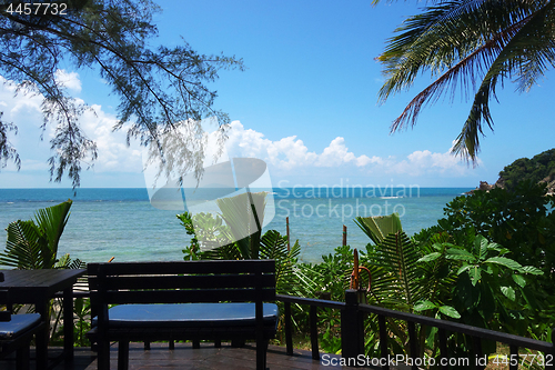Image of Tropical beach with deckchair