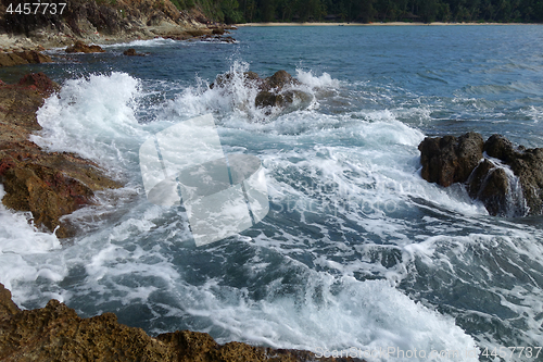 Image of Waves on stone beach