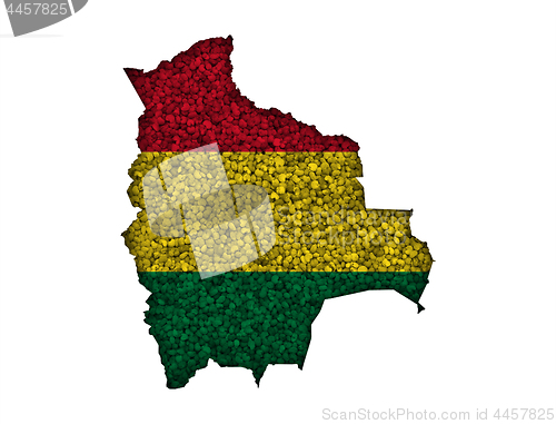 Image of Map and flag of Bolivia on poppy seeds