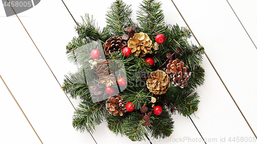 Image of Christmas Wreath on White Wooden Background