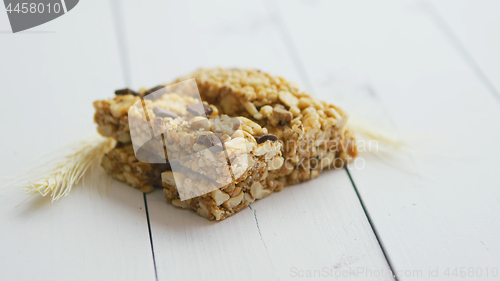 Image of Granola bars with dried fruits wooden background