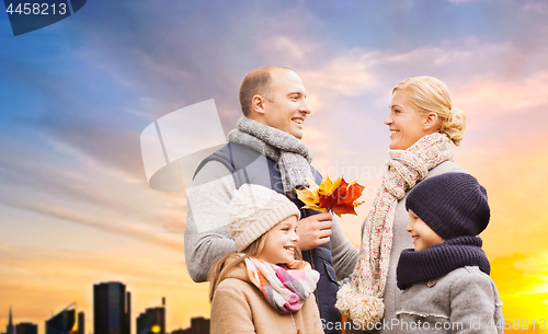 Image of happy family over sunset in tallinn city in autumn