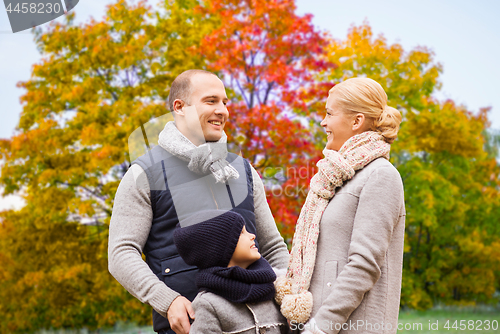 Image of happy family over autumn park background