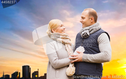 Image of smiling couple leaves in autumn