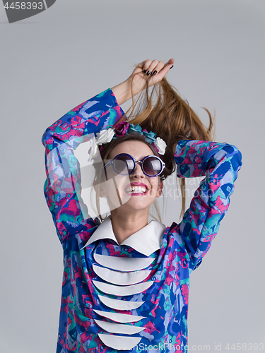 Image of woman posing in fashionable clothes and sunglasses