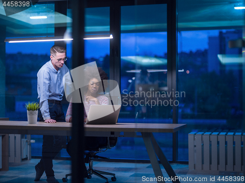 Image of Multiethnic startup business team in night office