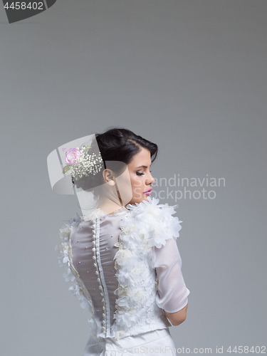 Image of Rear view of a beautiful young woman in a wedding dress