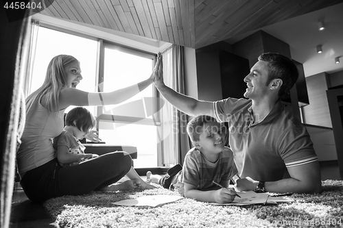 Image of young couple spending time with kids