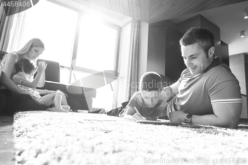 Image of young couple spending time with kids