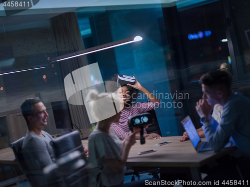 Image of Multiethnic Business team using virtual reality headset