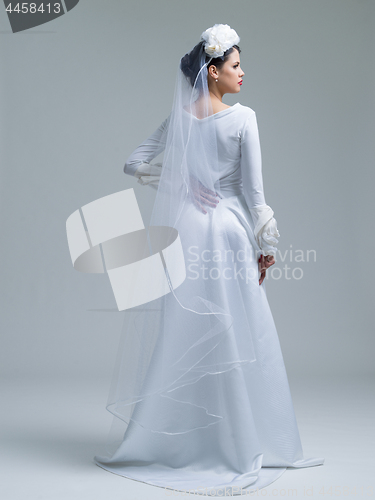 Image of Rear view of a beautiful young woman in a wedding dress