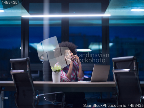 Image of black businesswoman using a laptop in startup office