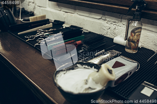 Image of Barber shop tools on the table. Close up view shaving foam.