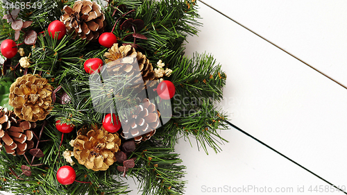 Image of Christmas Wreath on White Wooden Background