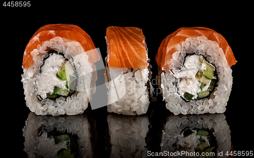 Image of Three pieces of sushi rolls Philadelphia