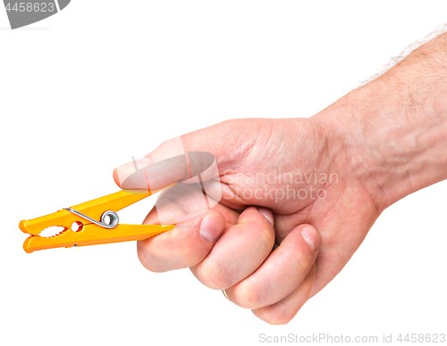 Image of Hand with color clothespin