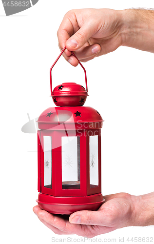 Image of Hand holding red lantern