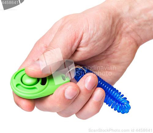 Image of Hand with dog clicker on white