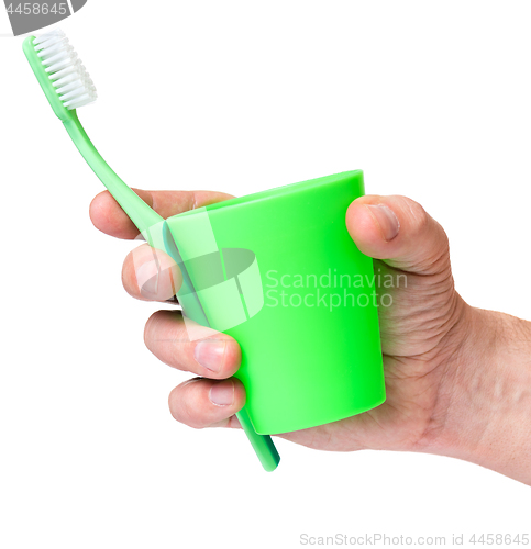 Image of Hand with toothbrush on white 