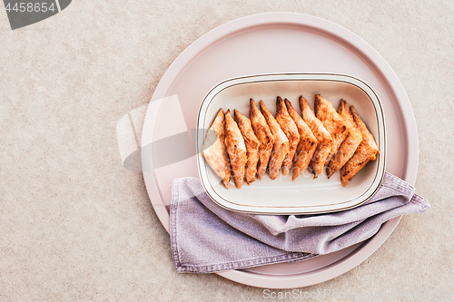 Image of Cheese pies on a pink tray