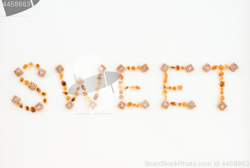 Image of SWEET written with brown sugar pieces