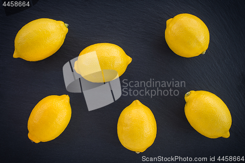 Image of Fresh lemons on dark background