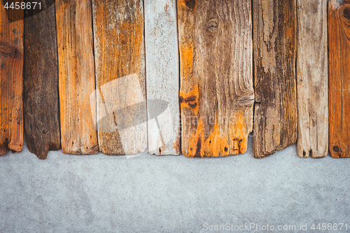 Image of Old wooden planks on concrete background