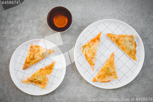 Image of Cup of tea and vegetarian cheese pies