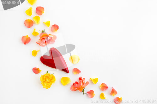 Image of Red heart and rose petals