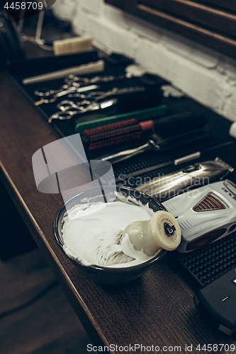 Image of Barber shop tools on the table. Close up view shaving foam.