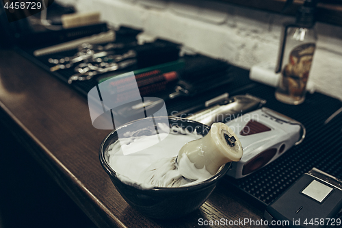 Image of Barber shop tools on the table. Close up view shaving foam.