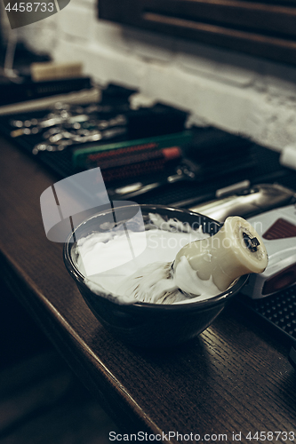 Image of Barber shop tools on the table. Close up view shaving foam.