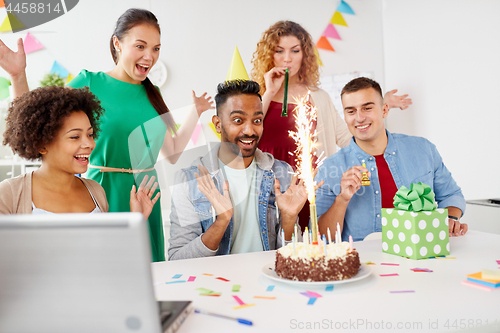 Image of office team greeting colleague at birthday party