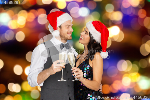 Image of couple with champagne glasses at christmas party