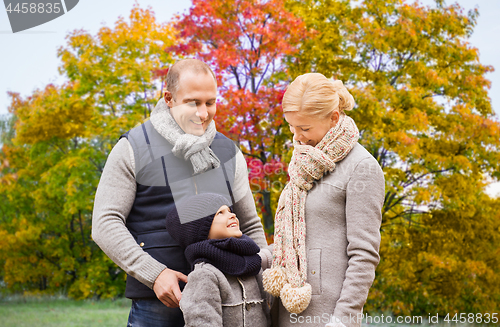 Image of happy family over autumn park background