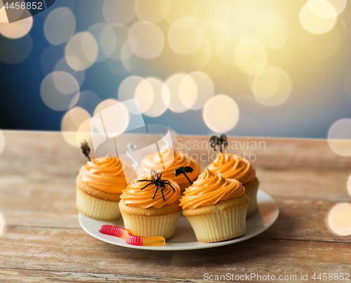 Image of halloween party decorated cupcakes on plate