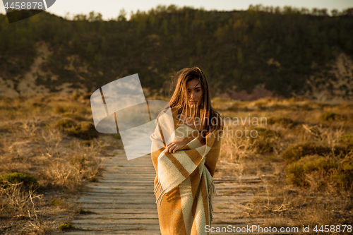 Image of Beautiful woman wrapped in a wool towel
