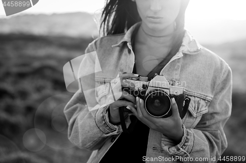 Image of Woman Taking Picture Outdoors