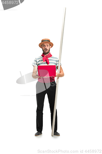 Image of Caucasian man in traditional gondolier costume and hat