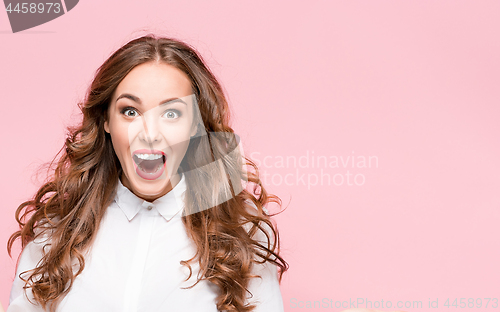 Image of Surprised happy beautiful woman looking in excitement.