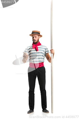 Image of Caucasian man in traditional gondolier costume and hat