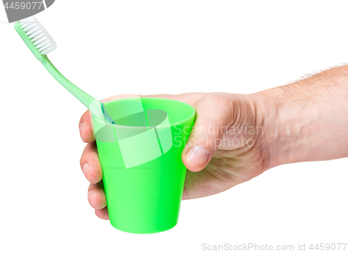 Image of Hand with toothbrush on white 