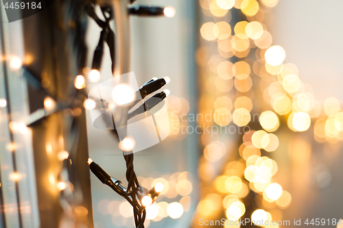 Image of close up of christmas garland on window