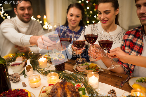 Image of close up of friends with wine celebrate christmas