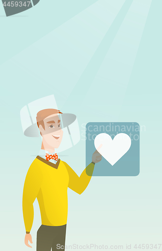 Image of Young man pressing heart shaped button.