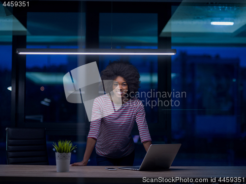 Image of black businesswoman using a laptop in startup office