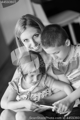 Image of Young Family Using A Tablet To Make Future Plans