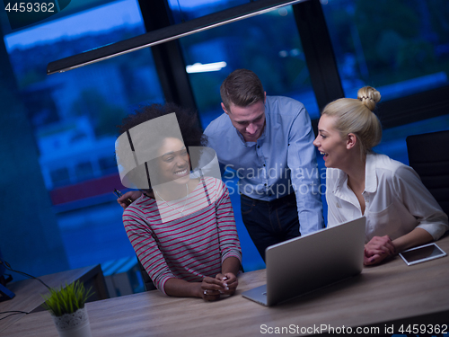 Image of Multiethnic startup business team in night office