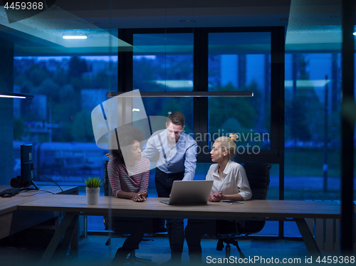 Image of Multiethnic startup business team in night office